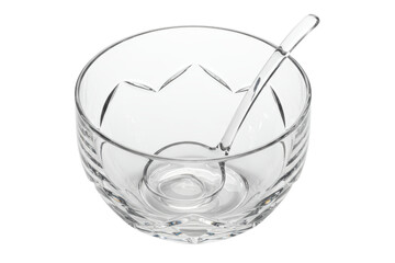 Clear crystal serving bowl with a small glass ladle inside on a transparent background
