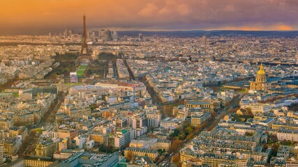 Panoramic aerial view of a dense city skyline at sunset