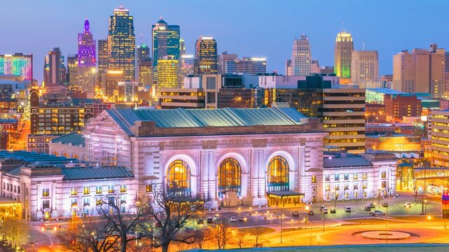 Kansas city skyline at dusk with historic union station illuminated