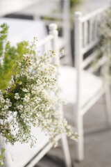 White Daisy and Greenery Floral Decoration on Wedding Chair