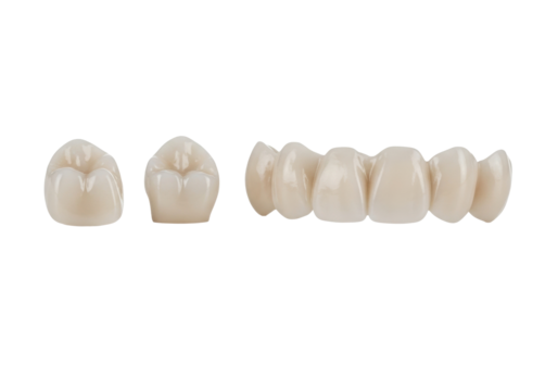 Porcelain dental crowns and a bridge, A2 Vita shade, anatomical, arranged on transparent, soft bokeh, copy space, macro close-up, studio lighting, concept of advanced dental technology