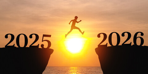 New Year 2026, Inspiration and progress towards new success. silhouette of a people jumping out off a cliff with the number 2025, heading towards the number 2026. new year goals and challenge  concept
