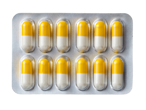 Yellow and white capsules in blister pack, pharmaceutical medication pills, antibiotic or supplement dosage, isolated on white background
