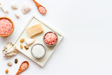 Naklejka na ściany i meble Essential oil and spa cosmetic products with sea shells, top view. Beauty spa therapy cosmetics and wellness background