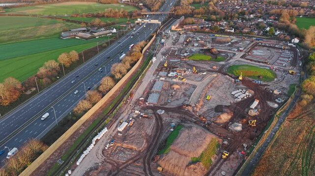 Building site for new housing alongside motorway, Warrington, England