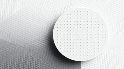 White circular object with dot pattern on textured surface