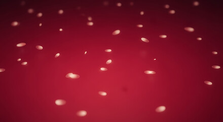 Abstract red background with falling white particles and bokeh effect