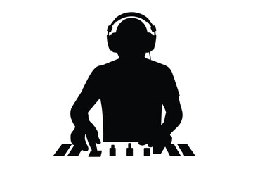 Silhouette of a dj with headphones playing music on a synthesizer