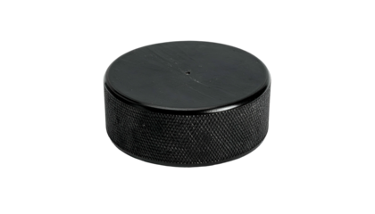 Isolated black hockey puck with textured edges on black