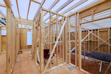 Wooden framing of house is underway, rafters beams layout construction details
