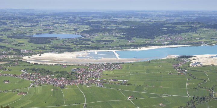 Panorama in spring from Tegelberg, 1881m, of Schwangau, Waltenhofen, Hopfensee and the partly still drained Forggensee, Ostallg&auml;u, Bavaria, Germany