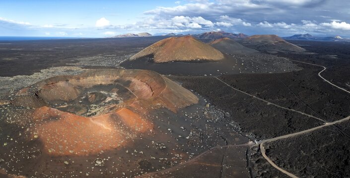 Monta&ntilde;a Quemada and Monta&ntilde;a Pedro Perico volcanoes, volcanic landscape with craters and lava fields, aerial view, Lanzarote, Canary Islands, Spain