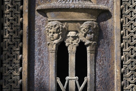 Relief, children's heads, grave, Montparnasse cemetery, Paris, France