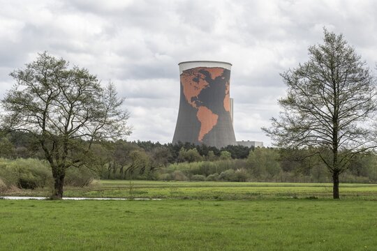 Cooling tower of the former gas-fired power station in Meppen, Emsland, Lower Saxony, Germany, painted with a world map