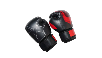 Two boxing gloves, black and red, against a black backdrop