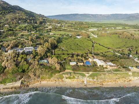 Atlantic Ocean coastline, Hurricane Hotel and the hinterland near Tarifa. Aerial view. Drone shot. C&aacute;diz province, Andalusia, Spain