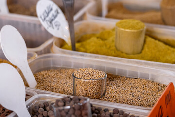 Assortment of various oriental spices on the counter at the Asian bazaar in close-up. Pyramids of spices. Heap different Asian Spices. Spice and seasoning. Assortment spices and herbs for cooking.
