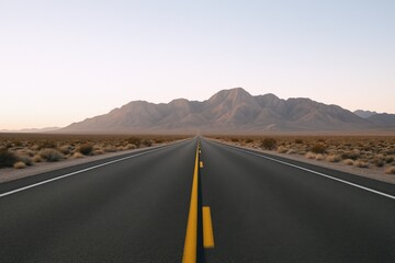 Naklejka premium Endless Desert Highway Leading to Distant Mountains Under a Clear Sky in a Scenic Landscape