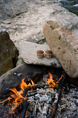 campfire cooking setup with muffins on rocks