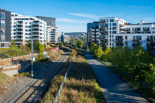 Urban development in Oslo&rsquo;s loren district shown through wide angle contemporary architecture and housing integrated with surrounding green areas in Norway