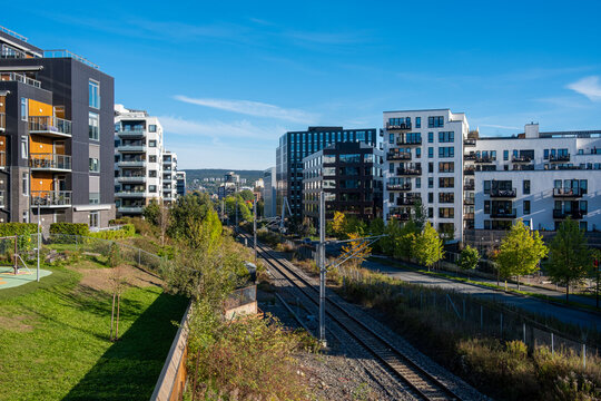 Urban housing development captured in a wide angle perspective featuring contemporary architecture within the loren district of Oslo, Norway, surrounded by green areas