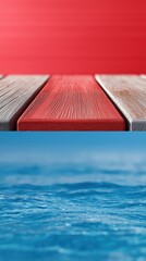 Vivid contrast of red wooden deck overlooking tranquil blue ocean waters