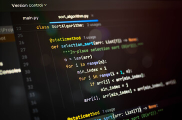 Close-up of abstract programming code with colorful syntax on a dark background, visualizing a selection sort algorithm structure, ideal for tech education, coding concepts, or logic tutorials.