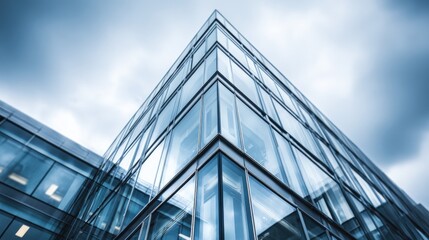 Modern Office Building Exterior with Glass Facade and Contemporary Architecture Against Cloudy Sky