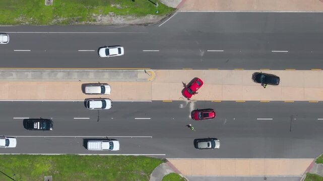 Car accident on American street. Emergency services helping victims of vehicle crash on road in USA.