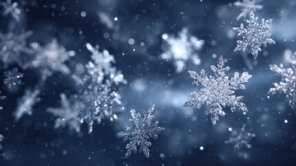 Delicate snowflakes falling softly against a blurred, dreamy blue background, creating a serene winter scene