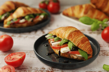 Croissants with mozarella cheese and tomatoes in caprese style