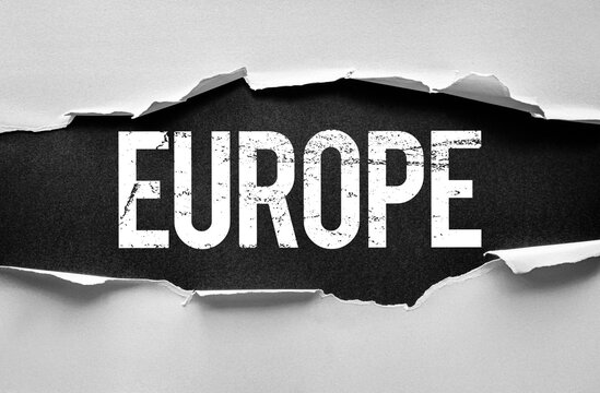 Word EUROPE appearing behind torn paper with a dramatic reveal effect. Conceptual image representing the continent, geography, politics, travel, unity, or European identity and news