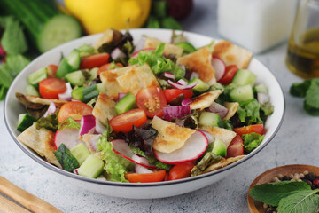 A bowl with Fattoush - Traditional Levantine salad