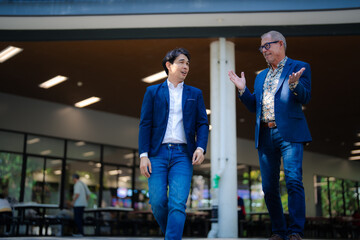 Businessmen walking and talking, discussing professional collaboration