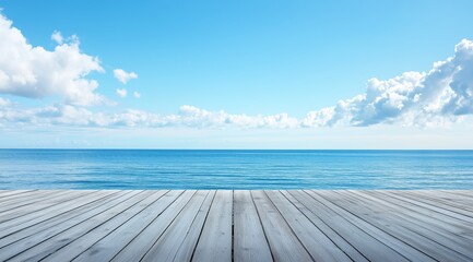 Wide View of Calm Ocean Under Clear Sky With Scattered Clouds and Wooden Deck in Foreground