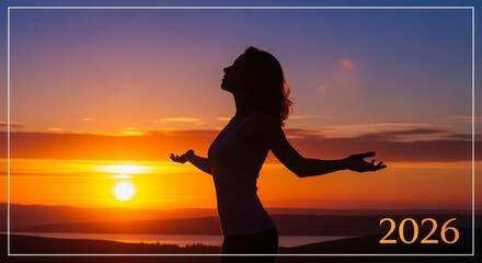 Woman embracing a vibrant sunset horizon in 2026 symbolizing hope and freedom