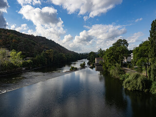 Fototapeta premium The Lot River as it flows through the medieval city of Cahors. Lot Valley, Ocitanie Region, France.