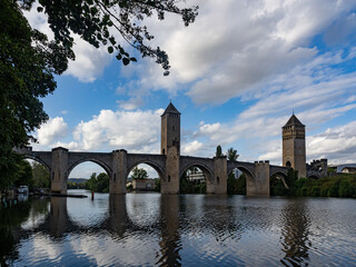 View of the Valentrén bridge, in the medieval city of Cahors, over the Lot River. Lot Valley, Ocitanie Region, France.