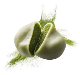Light green mochi dessert cut in half revealing green ice cream filling with matcha powder splash isolated on a transparent background