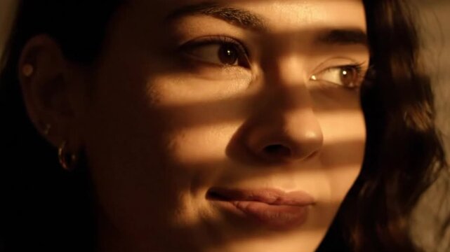 Close up portrait of a woman with striped shadows on her face, warm light