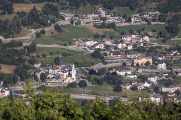 Summer aerial view of the town of Gignod, in Aosta Valley, Italy. Copy space above left.