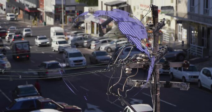 Pixel appearing near utility pole, forming spinning mesh globe labeling continents, dissolving back