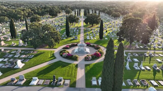 Solemn tribute resting places: Aerial view of a tranquil cemetery adorned with lush trees and