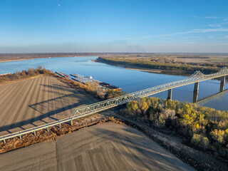 bridge and barges on the Mississippi  River at confluence with the Ohio River below Cairo, IL, November aerial view