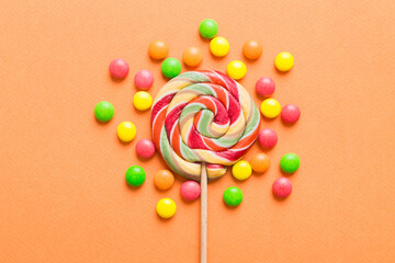 Tasty appetizing Party Accessories Happy Birthday Sweet. Different types of candies on colored background, copy space. Colorful birthday party background