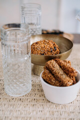 Oatmeal bowl. Healthy breakfast. Transparent glass cup with tasty wholegrain cookie snack rich in protein fiber calcium placed on defocused.