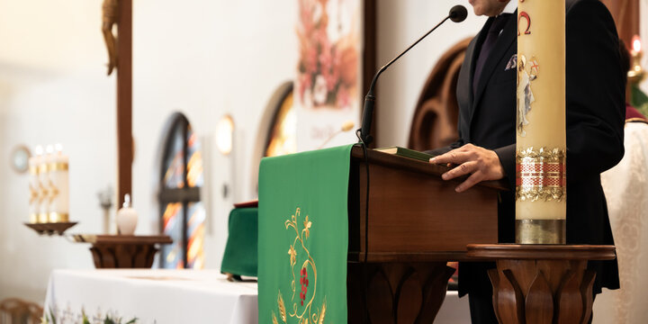 Speaker At Church Altar Delivering Message During Religious Wedding Ceremony