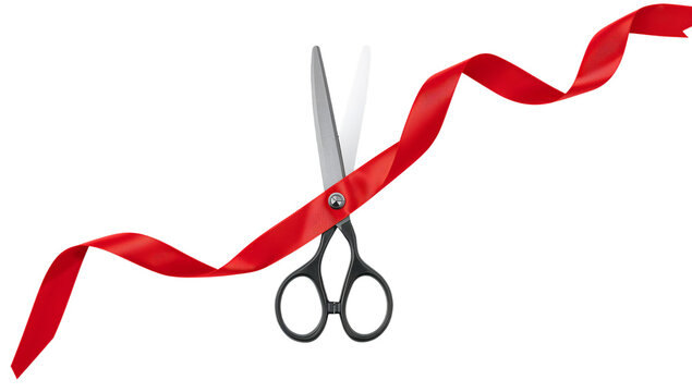 Scissors Cutting a Red Ribbon at a Celebration Event in a Festive Atmosphere