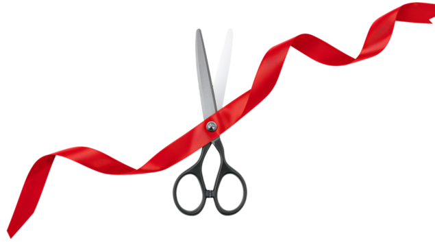 Scissors Cutting a Red Ribbon at a Celebration Event in a Festive Atmosphere