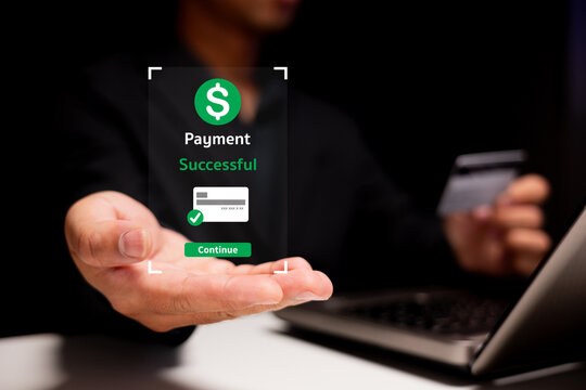A hand displays a digital confirmation of a successful payment, symbolizing online transactions and financial security.